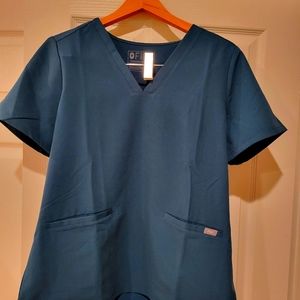 Figs scrub tops. 2 available.  Medium and Large. Caribbean Blue.